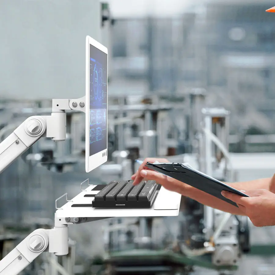 Keyboard tray on an arm below a mounted tablet
